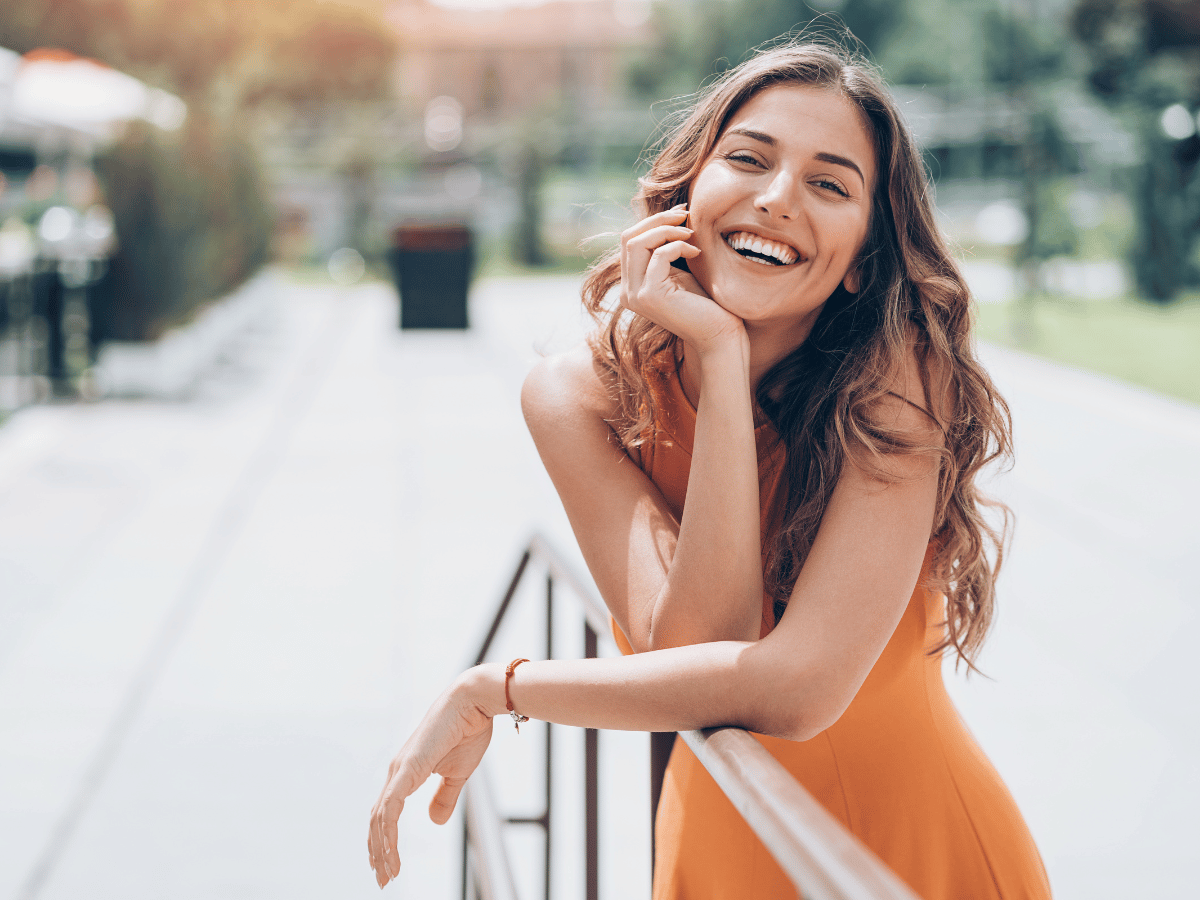 white woman happy because law of attraction is working