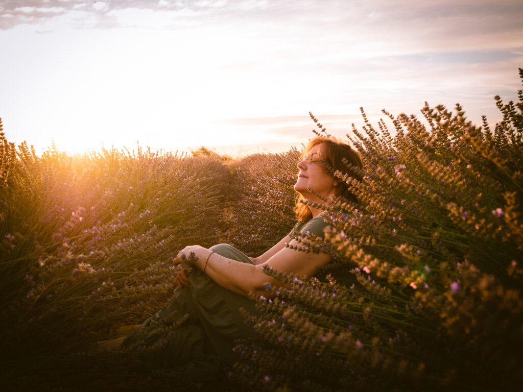 Portrait of a caucasian female in a beautiful view at sunset representing spiritual healing in nature