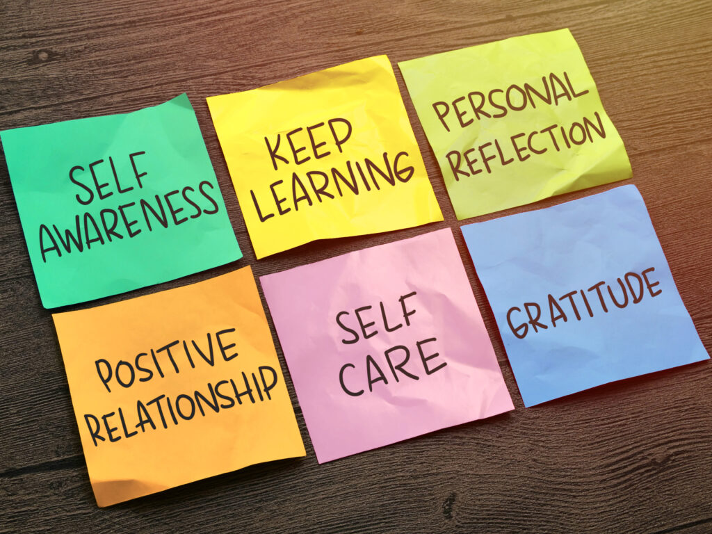 Colorful sticky notes with words related to personal development: Self Awareness, Keep Learning, Personal Reflection, Positive Relationship, Self Care, and Gratitude. Self improvement diagram, text words typography written on paper, life and business motivational inspirational concept