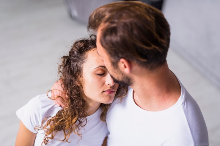 man comforting a woman