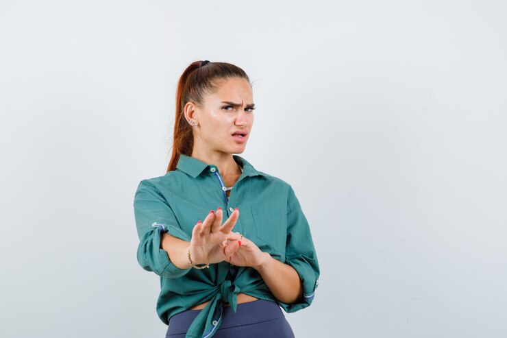 woman looking irritated, expression says to go away and represent the masculine shield