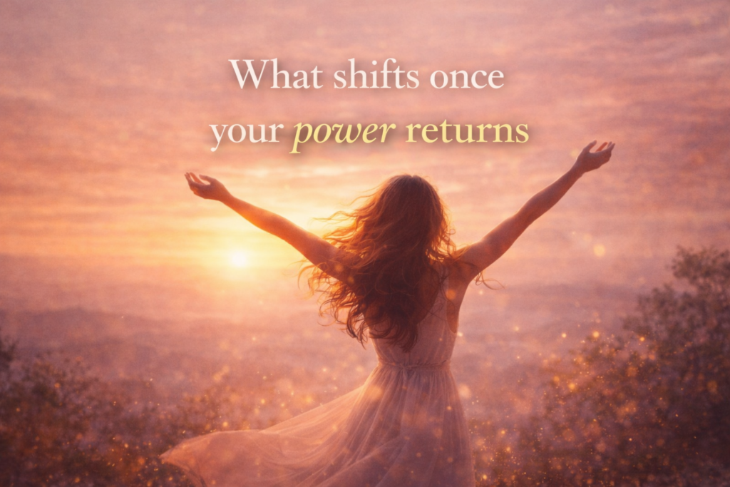 A woman stands in an open field at sunrise with her arms slightly lifted, surrounded by warm golden light. Soft text overlay reads: “What shifts once your power returns.”
