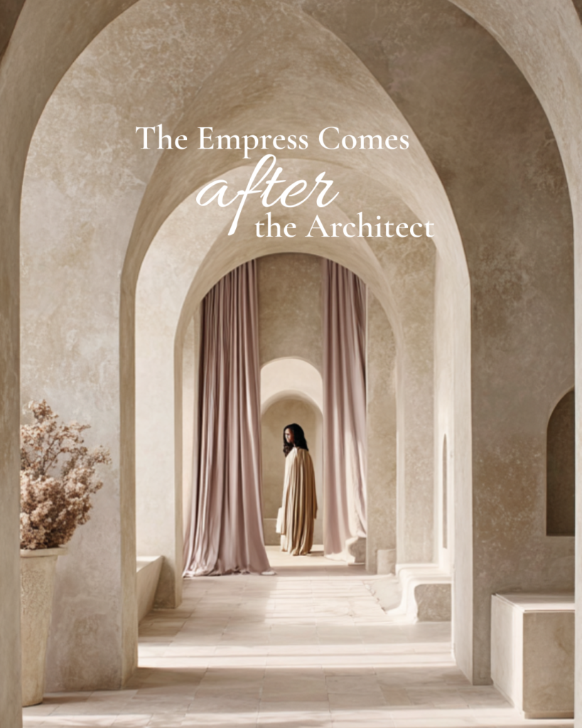 The Empress Archetype: Where Power Becomes Ease, showing a woman in a flowing gown standing beneath soft stone arches with draped curtains, embodying calm authority, feminine power, and quiet elegance.