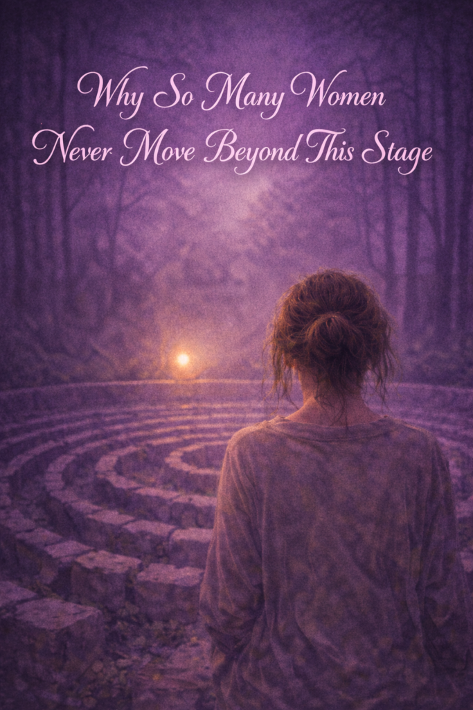 Archetypal image of a woman seen from behind standing at the edge of a stone labyrinth, surrounded by deep purple mist and soft golden light, symbolising why many women remain within the collapsed Mother archetype and do not move beyond this stage.